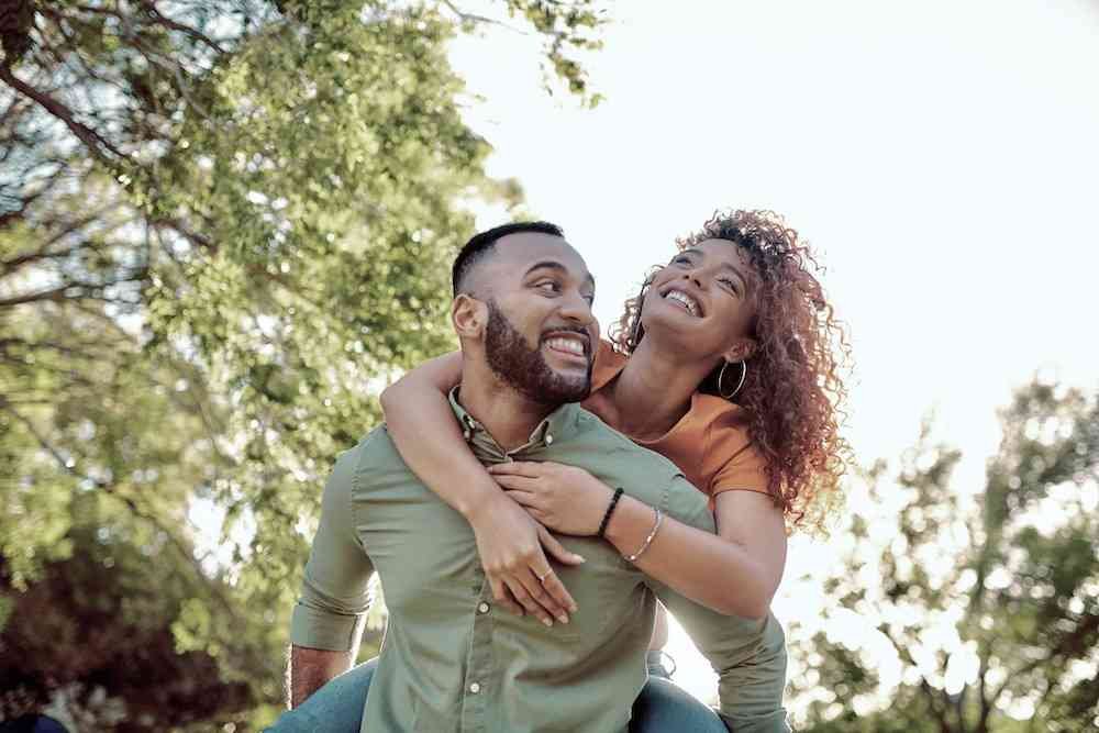 girl on guy's back
